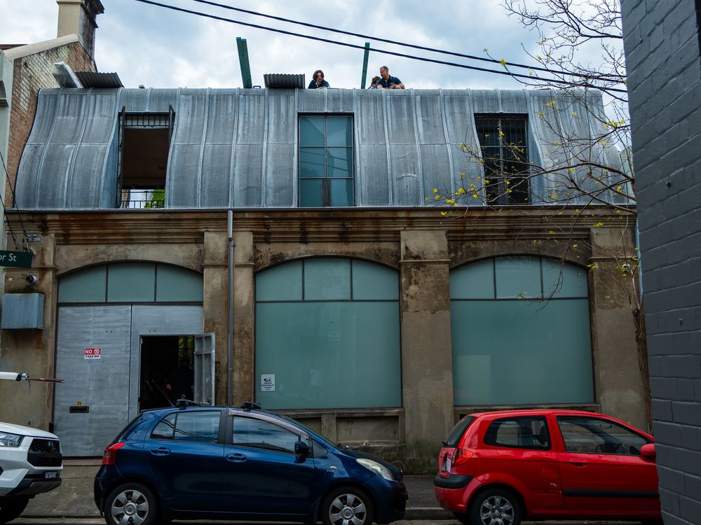 Curved heritage metal roof on an old Sydney warehouse